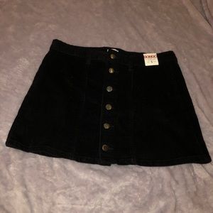 black button up skirt.